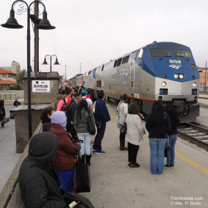 The late-arriving Southwest Chief rumbles into Albuquerque as passengers huddle against the cold wind. © William P. Diven.