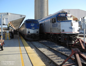 Amtrak's Southwest Chief rest on arrival in Los Angeles. On the right a commuter train waits to shove out. The Los Angles County jail rises in the background. © William P. Diven