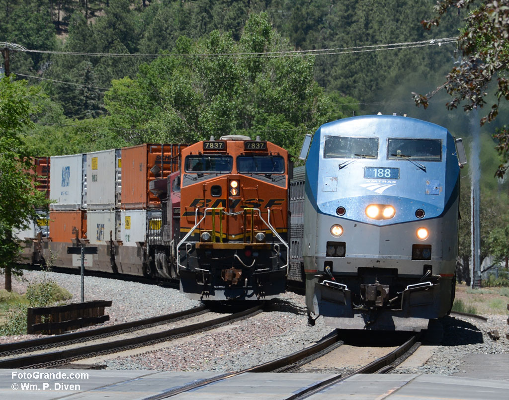 The Southwest Chief pulling into Flagstaff 7+ hours late passes a stopped freight train. Photo © William P. Diven.