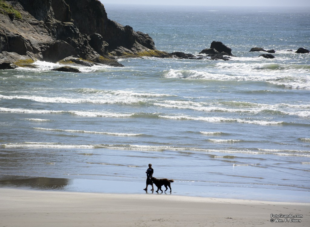Walking the dog on Short Sand Beach, Smuggler's Cove, Oregon. Photo © William P. Diven.