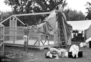 Counselor Keith Christensen on the ground and Phantom Lake YMCA Camp director Sir Gerald Carman on the ladder place the canvas top and sides on a new tent floor and frame. Summer 1968. Photo © William P. Diven. (Click to enlarge)
